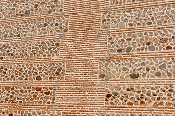 Texture of restored stone and brick ancient wall 
