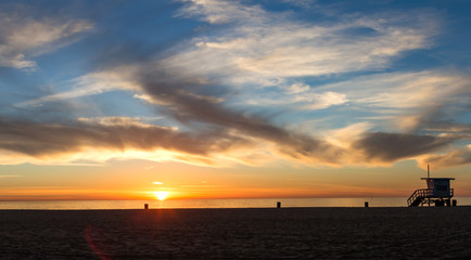 Panoramic view of sunset with lifeguard tower in Hermosa Beach California