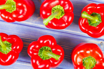 View from above on red peppers on purple boards, healthy nutrition