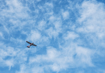 Small airplane in a cloudy sky