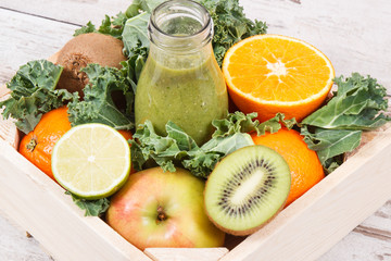 Freshly blended green coctail from fruits and vegetables. Diet and healthy nutrition concept
