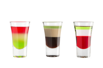 Alcohol shots on a white background. Three popular multicolored shots.