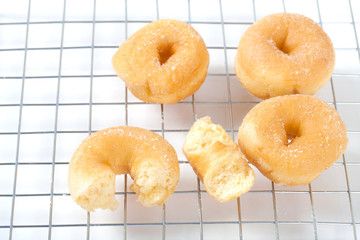Donut on grille isolated on white background with space for copy.