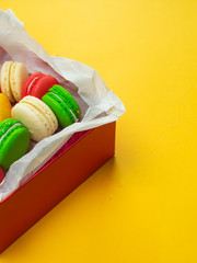 Colorful macaroons. Sweet macaroons on color background with copy space. Holiday time concept