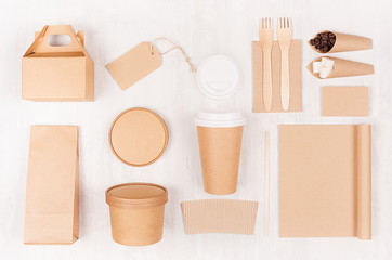 Food branding identity mockup in light modern style - blank coffee cup, packet, box, notebook, label, card of brown paper  on white wood board.