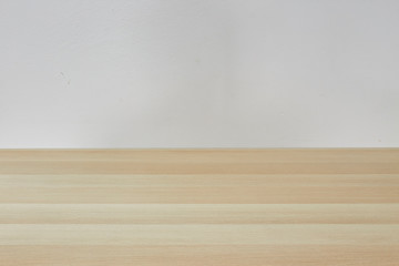 Empty light brown table in white room