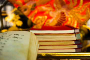 books of sutras lying in a Buddhist altar. 仏壇にあるお経の本
