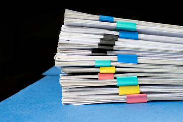 Mock up, stack of papers documents in archives files with paper clips on desk at offices, business...