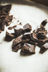 Grated chocolate on the table. Selective focus.