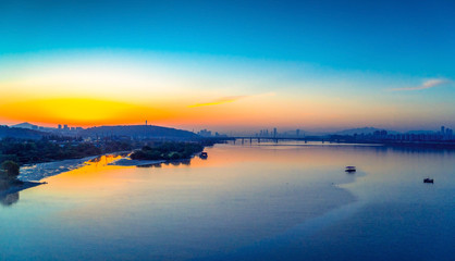 Sunrise at Hun River take picture from Airport Railroad Express (AREX) between Seoul to Incheon Airport , Seoul in South Korea.