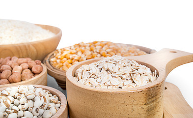 Cereal grains , seeds, beans on wooden background