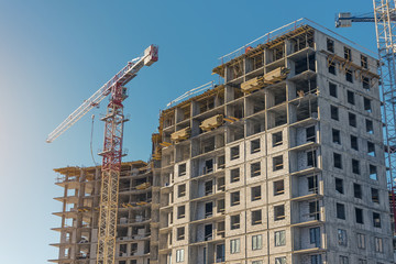Fototapeta na wymiar Construction site, high-rise multi-storey buildings under construction