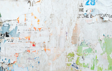 torn old posters on grunge billboard