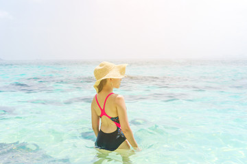 Summer Beach Holiday Woman relax on the beach in free time .