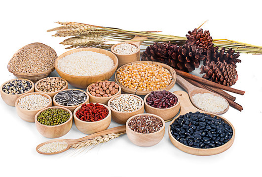 Cereal grains , seeds, beans on wooden background