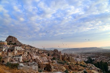 Fototapeta na wymiar View of ancient Nevsehir cave town and a castle of Uchisar dug from a mountains in Cappadocia, Central Anatolia,Turkey 