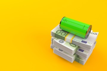 Green battery on stack of money