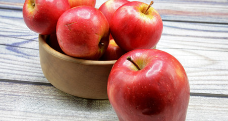 red apples on wooden table