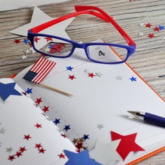 Diary with glasses open on the date of July 4, happy independence day, patriotism and memory of veterans 