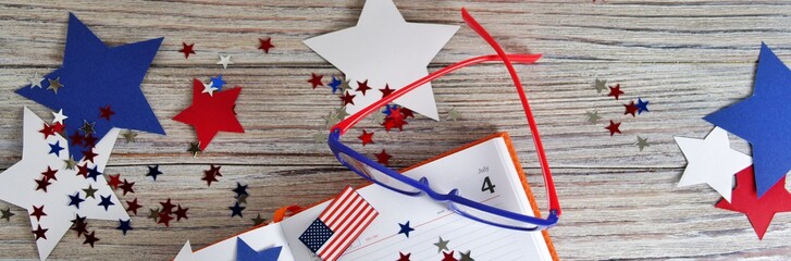 Diary with glasses open on the date of July 4, happy independence day, patriotism and memory of veterans 