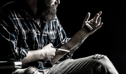 Straight razors, barbershop, beard, blade. Vintage tools for barbers, sharpen the blade in leather brush, razor blades. Straight razor.The bearded man holding a straight razor, tool. Black and white. - obrazy, fototapety, plakaty
