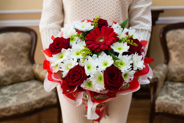 Beautiful wedding bouquet of flowers in bride’s hands