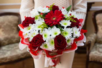 Beautiful wedding bouquet of flowers in bride’s hands