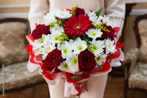 Beautiful wedding bouquet of flowers in bride’s hands