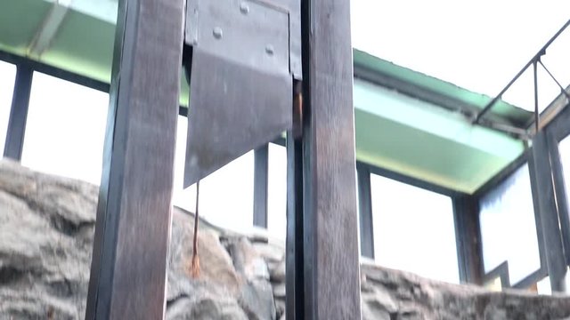The guillotine in the stone room of the prison, ready for execution.