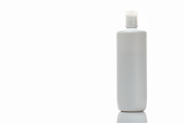 Isolated plain white plastic bottle template. Plastic bottle with soap or shampoo without label reflected on white background.