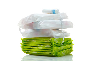 Clean white cotton tampon and pads isolated on a white.  Woman hygiene protection in period. Menstruation cycle, critical days concept.