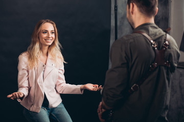 pretty positive girl and a man having a talk, close up photo.love, model is flirting with a photographer