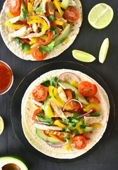 Fototapeta na wymiar Tacos with chicken meat and vegetables