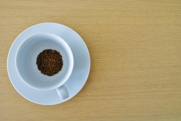 cup of coffee on wooden table