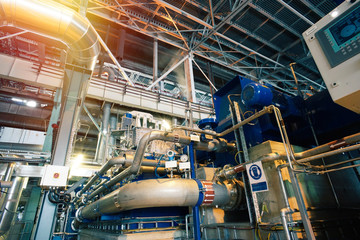 Equipment, cables and piping as found inside of a modern industrial power plant