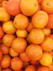 Healthy fruits, orange fruits background many orange fruits - orange fruit background in a supermarket super store