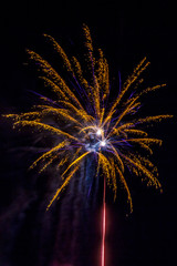 populous festive multi colour fireworks outside the city in the summer camp on isolated background of the night black sky