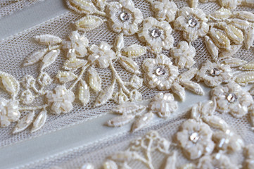Fototapeta na wymiar fine white lace embroidery