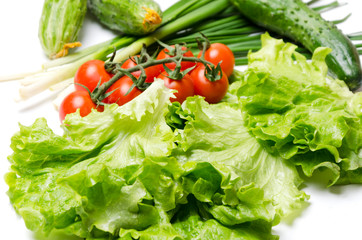 Green onion,lettuce leaves,cucumber,tomatoes cherry for cooking on the kitchen table,closeup