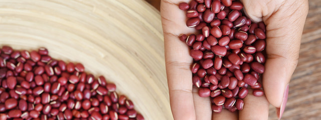 close up of red beans in hand 