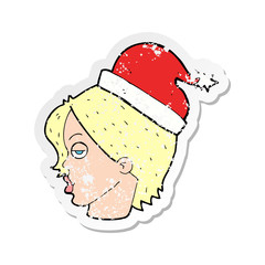 retro distressed sticker of a cartoon woman wearing santa hat