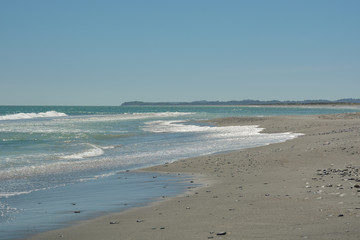 One of the many beaches of Pacific Ocean near city of Okarito on New Zealand