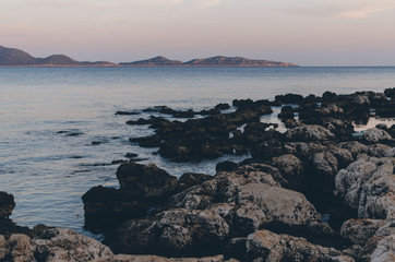 Dramatic Sunset over Mountain silhouettes under red sky and blue Sea on fethiye Mediterranean Turkey