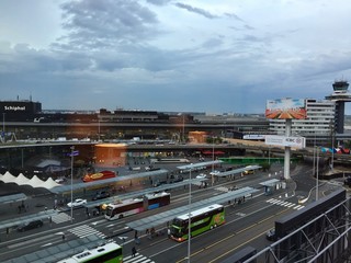 Schiphol airport and control tower seen through the window of a hotel room. Amsterdam, Netherlands