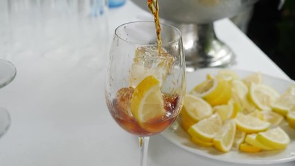  Waiter serving glass of aperitif with alcohol