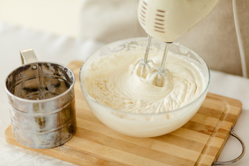 preparation of pie using mixer.close up cropped photo
