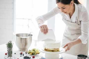 beautiful woman smoothing cream at workplace, close up photo. free time, spare time