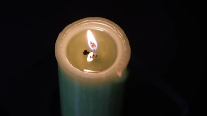 Candle flame close up on a black background