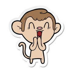 sticker of a cartoon laughing monkey