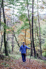 Fototapeta premium Hiker - man hiking in forest